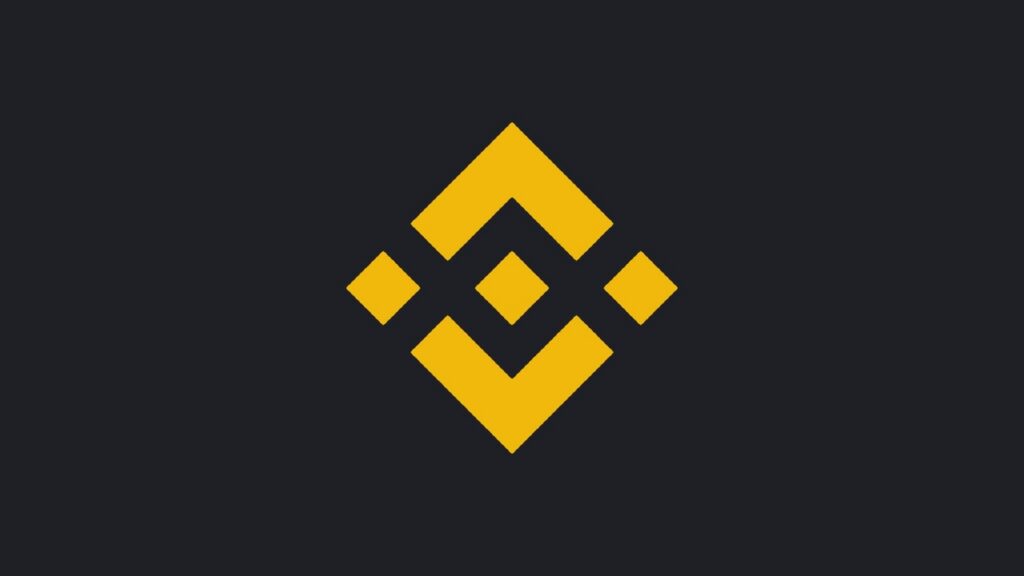 Logo de Binance, un rombo amarillo formado por cinco piezas, sobre fondo gris oscuro.